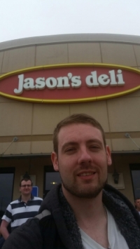 Jason in front of Jason's Deli