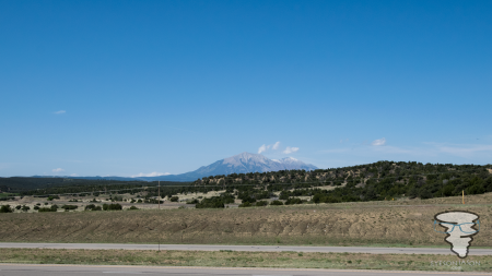 Rocky Mountains in the background, driving along the I25