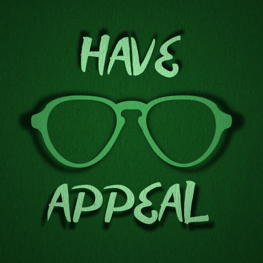 A green silhouette of a pair of glasses appear on a green background with the words 