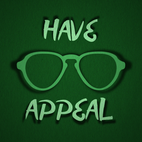 A green silhouette of a pair of glasses appear on a green background with the words A green silhouette of a pair of glasses appear on a green background with the words