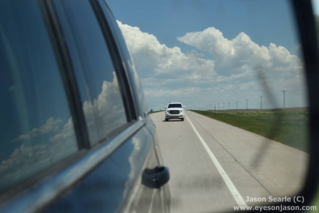 Cumulus field and the other chase vehicle in the wing mirror