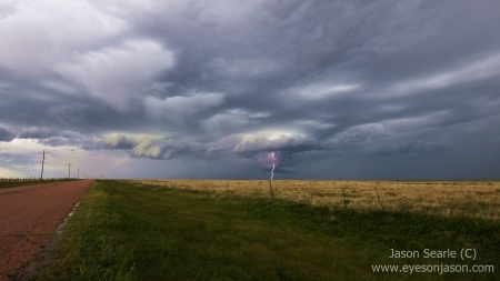 Lightning strikes through the lowering in the storm