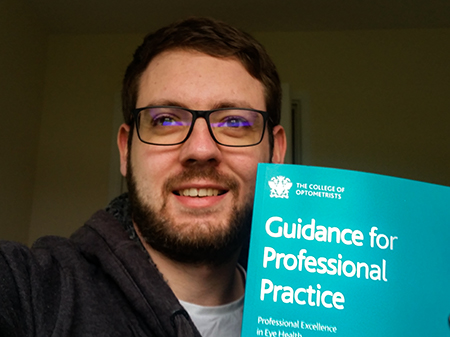 Jason with the College of Optometrists' Handbook