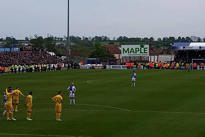 Police and stewards guard the Millwall supporters